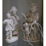 A Japanese ivory okimono of a man with a monkey on a rope, another of a male and a female figure, on