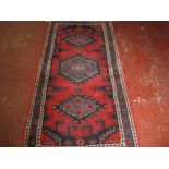 An Indian rug 108 x 214cm