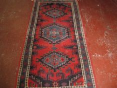 An Indian rug 108 x 214cm