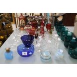 A quantity of glassware to include a set of six green glass bowls, a red gilded glass comport, a red