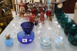 A quantity of glassware to include a set of six green glass bowls, a red gilded glass comport, a red