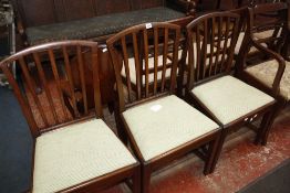 A set of three George III mahogany dining chairs