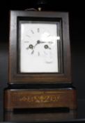 A 19th Century French rosewood inlaid mantel clock, Leroy Paris, Roman numeral enamel dial (crack to