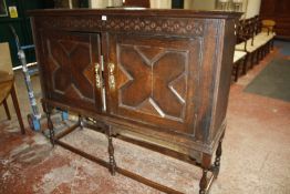 An oak cupboard on stand, 17th century and later 132cm high, 162cm