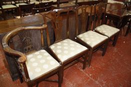 A set of three 19th Century dining chairs with pierced splat and drop in seat and a corner armchair