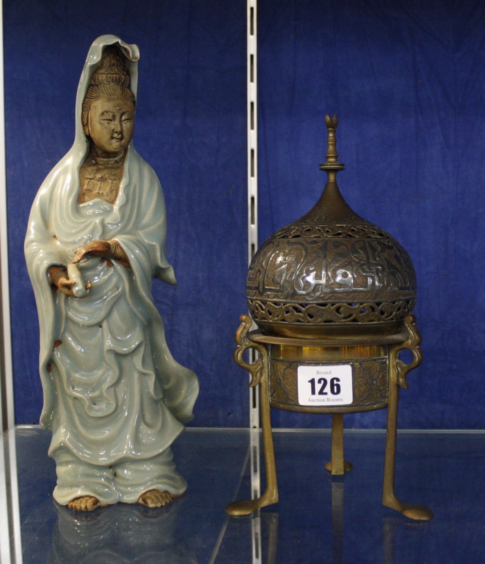 A Chinese celadon glazed guanyin, 28cm high and an Islamic censer and cover (2)