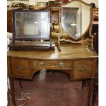 A mahogany kneehole bowfront dressing table 107cm wide and two mahogany toilet mirrors