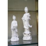 Two early 20th Century Blanc de Chine guanyin figures, 23cm high and 16cm high (2)