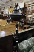 A wrought iron standard lamp (sold as parts)