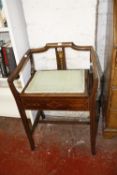 An Edwardian mahogany and inlaid piano stool; and a mahogany flamed mirror 68cm high, 53cm wide (2)