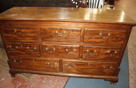 A mahogany chest of drawers, circa 1780 and later, formerly a mule chest, now with lift top above