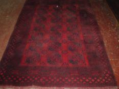 An Afghan carpet 302 x 214cm