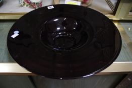 A purple studio glass bowl, unmarked, 46cm in diameter