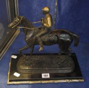 A bronze model of a horse with jockey, signed E.Loiseau, on rectangular plinth base, 31cm high and