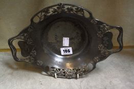 A 20th Century pewter two-handles dish, decorated with clovers and another pewter dish (2)