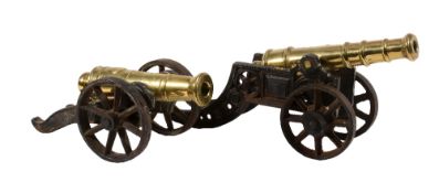Two late Victorian brass and iron mounted models of canon, late 19th century, the larger example