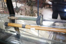 A silver mounted swagger stick, together with two fencing foils and a face guard.