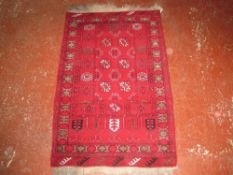 An Afghan rug 78 x 130cm