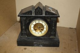 A late 19th/ early 20th Century black slate pediment mantel clock, 27cm high