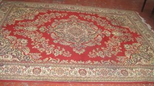 A Middle Eastern style rug 250cm x 350cm, together with two similar