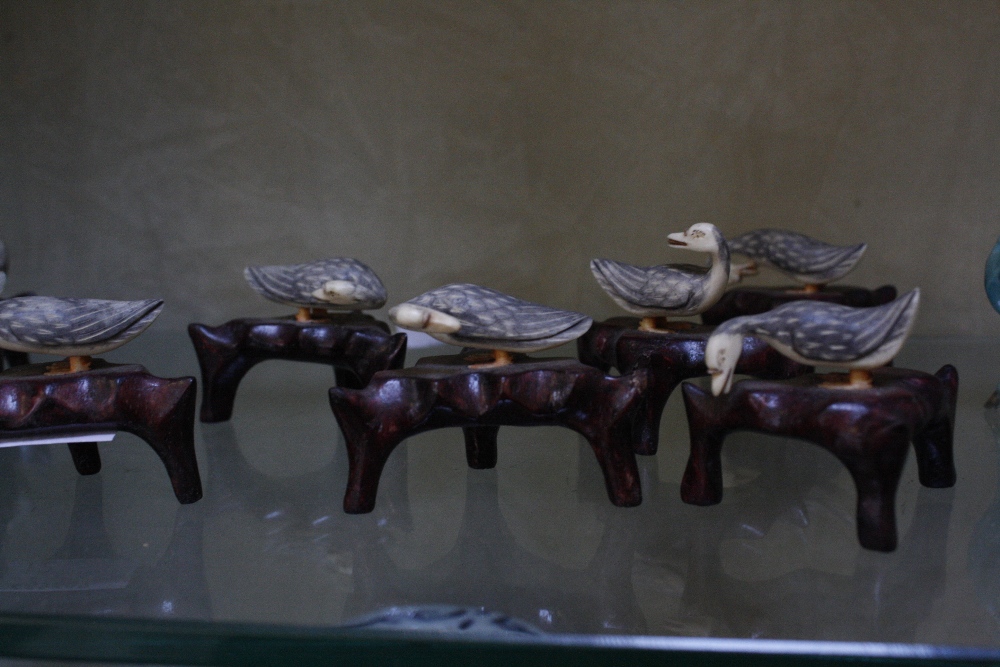 Eight miniature Chinese turquoise glazed models of horses and eight miniature ivory ducks on