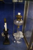 A Matthew Boulton style brass lamp, 46cm high (sold as parts) and a glass oil lamp converted to a