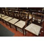 A set of six Regency style mahogany dining chairs to include two armchairs