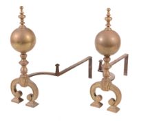 A pair of brass and wrought iron mounted andirons, early 18th century, the uprights with knopped and