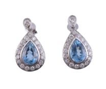 A pair of aquamarine and diamond ear pendents,   the pear shaped aquamarines each suspended from a