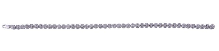 A diamond line bracelet  , the bracelet with forty four brilliant cut diamond set clusters,