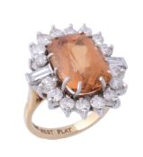 A golden topaz and diamond cluster ring , the mixed cushion cut topaz  A golden topaz and diamond