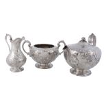 A Victorian silver compressed spherical three piece tea service by Martin  A Victorian silver