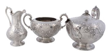 A Victorian silver compressed spherical three piece tea service by Martin  A Victorian silver
