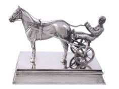 A silver model of a trotting race horse with jockey on board by John Edward...  A silver model of