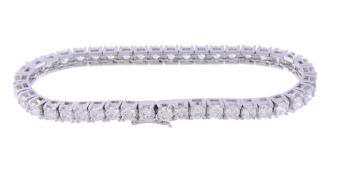A diamond line bracelet, the articulated bracelet set along the line with...  A diamond line