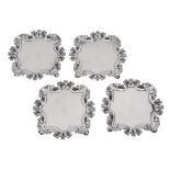 A set of four George II silver shaped square small salvers by James Shruder  A set of four George II