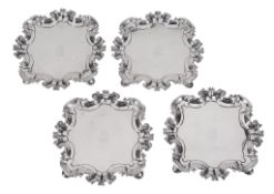 A set of four George II silver shaped square small salvers by James Shruder  A set of four George II