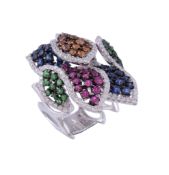 A multi gem set ring, the leaf shaped panels set with circular shaped sapphires  A multi gem set
