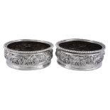 A pair of George IV silver circular wine coasters by S. C. Younge & Co  A pair of George IV silver