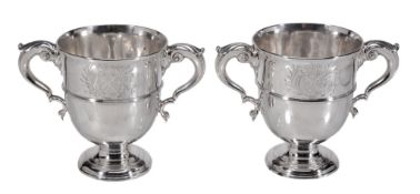 A pair of mid 18th century Irish silver twin handled cups by Michael Byrne  A pair of mid 18th
