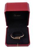 A Just Un Clou gold bracelet by Cartier, the bracelet in the form of a...  A Just Un Clou gold