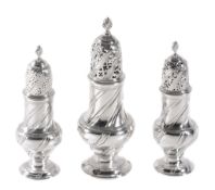 A set of three early George III silver casters by Robert Peaston, London 1762  A set of three