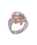 A diamond and coloured diamond ring, the oval shaped facetted diamond claw...  A diamond and
