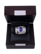 A tanzanite and diamond dress ring , the oval cut tanzanite A tanzanite and diamond dress ring , the