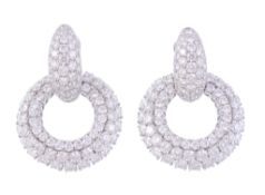 A pair of diamond hoop earrings, the circular panels set throughout with...  A pair of diamond
