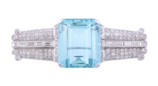 An aquamarine and diamond brooch, the central rectangular step cut...  An aquamarine and diamond