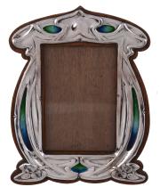 An Arts and Crafts silver and enamel photograph frame by Charles S An Arts and Crafts silver and