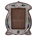 An Arts and Crafts silver and enamel photograph frame by Charles S An Arts and Crafts silver and
