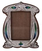 An Arts and Crafts silver and enamel photograph frame by Charles S An Arts and Crafts silver and