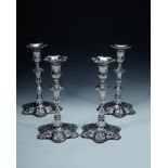 A matched set of four late George II cast silver hexafoil candlesticks by... A matched set of four